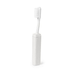 A toothbrush in a white case, featuring a soft-bristled head and a minimalist design.