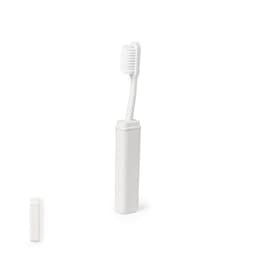 A white toothbrush with a matching case, featuring a sleek design and eco-friendly materials.