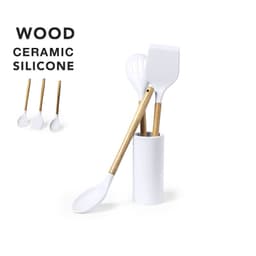 A kitchen utensil set featuring white ceramic and silicone spoons with wooden handles in a white holder.