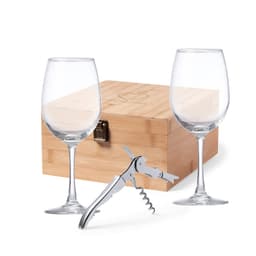 A wine gift set featuring two clear glasses, a corkscrew, and a wooden box. The glasses are elegantly shaped.