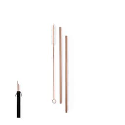 A set of copper drinking straws with a cleaning brush, packaged in a black pouch.
