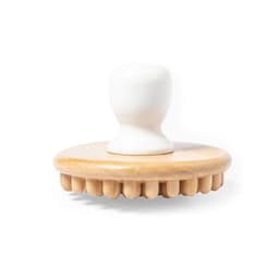 A wooden massager with a white handle and rounded base featuring protruding spikes for massage therapy.