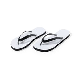 A pair of thongs in white with black straps and soles, featuring a logo on the footbed.