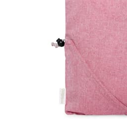 A pink foldable bag featuring a drawstring closure and a logo tag.