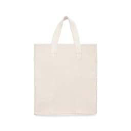 A plain cream tote bag with two sturdy handles and no visible branding.