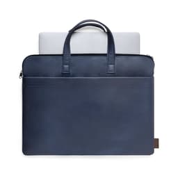 A navy blue bag with two handles and a front pocket, accommodating a laptop inside. It features a logo.