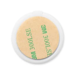 A round white phone stand featuring a sticky adhesive base with a protective backing.
