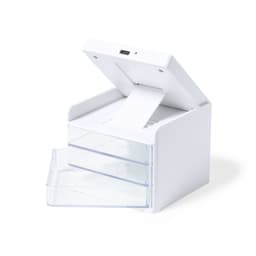 A compact white wireless charger with a top opening and two clear drawers. It has a USB port on the back.