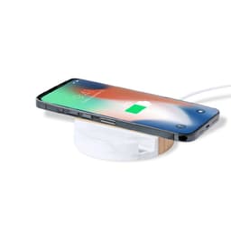 A wireless charger in white and bamboo, with a smartphone displaying a charging status on top.