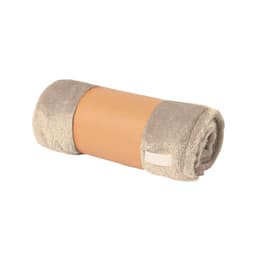 A rolled blanket featuring a soft, beige exterior and a plush texture, accompanied by a branding label.