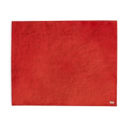 A red Durmok Blanket featuring a soft texture and a small logo in the corner.