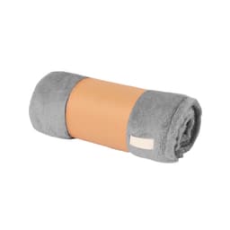 A rolled grey blanket with a tan band, featuring a logo, showcasing a soft and plush texture.