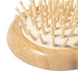 A bamboo hairbrush base with numerous wooden bristles, designed for hair and beauty care. It features a natural finish.