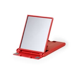 A red phone stand featuring a mirror, designed to hold devices at an adjustable angle.