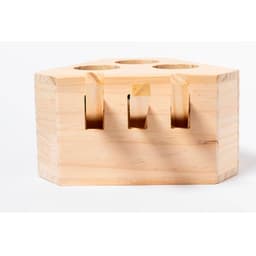 A wooden game block in a hexagonal shape with three circular holes, unstained and featuring a natural finish.