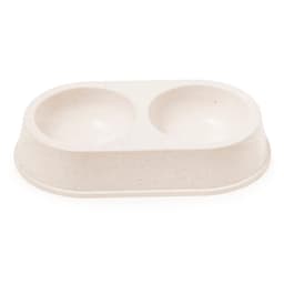 A double pet bowl in a light beige colour, featuring two rounded compartments on a raised base.
