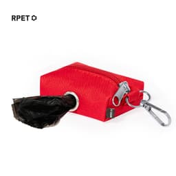 A red waste bag dispenser featuring a zip closure and a clip, with a black waste bag partially visible.