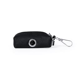 A black waste bag dispenser with a silver ring and a clip for attaching to items. Features a textured exterior.