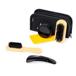 A grooming kit featuring wooden brushes, a black comb, a black container, and a yellow cloth, all in a black zippered case.