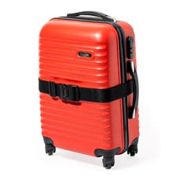 A red suitcase with a textured surface, featuring a black strap and wheels for easy mobility. It has a logo on the side.