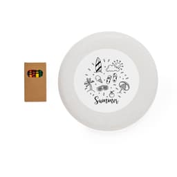 A frisbee in a light grey colour featuring a summer-themed design, accompanied by a box of coloured pencils.