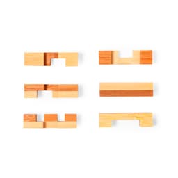 A set of six wooden puzzle pieces in varying shapes and shades of brown and natural wood.