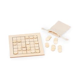 A wooden Sudoku board with light-coloured tokens and a small beige drawstring bag.