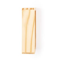 A wooden puzzle piece with a smooth finish and light colour, featuring natural grain patterns.