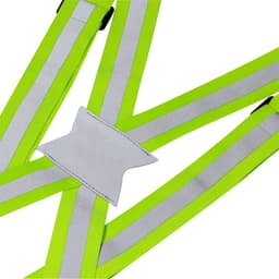 A reflective safety harness in bright yellow with silver detailing and a central white panel.