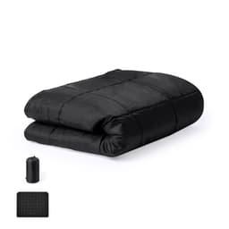 A black picnic rug neatly folded, accompanied by a compact carrying pouch in the corner.