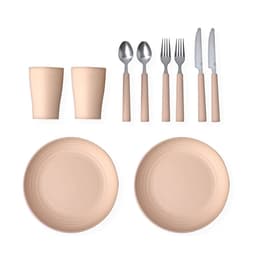 A set of two beige plates, two cups, and cutlery including forks, knives, and spoons with beige handles.
