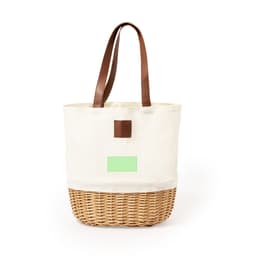 A cream and wicker picnic basket with brown leather handles and a plain area for branding.