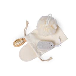 A natural loofah, a wooden brush, a pumice stone, and a fabric pouch in neutral tones.