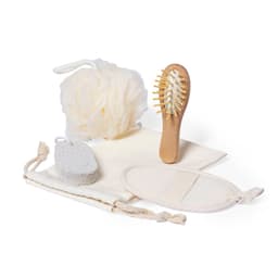 A beauty set featuring a wooden hairbrush, loofah, exfoliating sponge, and a cotton storage pouch, all in neutral colours.
