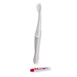 A white toothbrush and a red tube of toothpaste, presented together in a tidy arrangement.
