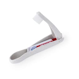A white travel toothbrush holder with a toothbrush and toothpaste inside, featuring a speckled design.