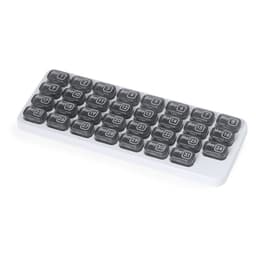 A medication organiser with 31 compartments, featuring grey lids and a white base, for daily dosage tracking.