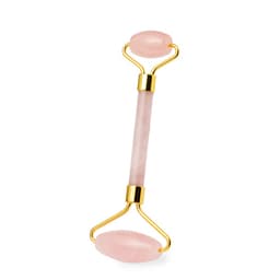 A pink jade facial roller with gold accents, featuring two smooth ends for skincare routines.