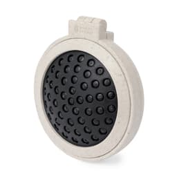 A round, textured black mat with a beige border, featuring a logo at the top.