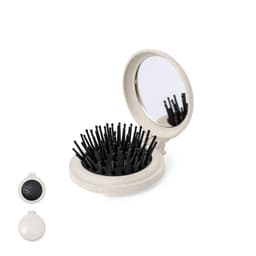 A compact mirror with a black bristle brush, featuring a round, light-coloured case. It has a logo on the surface.