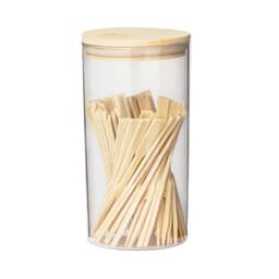 A clear container filled with wooden cutlery sticks, topped with a bamboo lid.