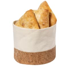 A fabric and cork container holds several triangular pastries, featuring a beige fabric upper and cork base.