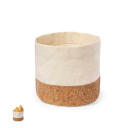 A storage basket featuring a cream fabric upper and a cork bottom, ideal for organising home items.