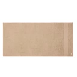 A beige hand towel with a soft texture, featuring a subtle stripe design and a branding logo.