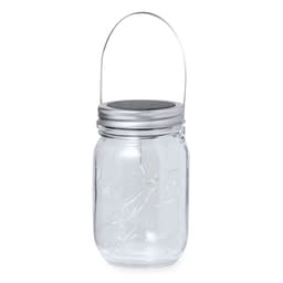 A clear glass lamp with a silver lid and handle, featuring decorative lights inside.