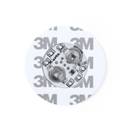A circular coaster featuring a clear design with a 3M logo and electronic components visible on the surface.