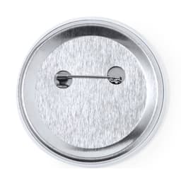 A circular silver button badge featuring a metal pin on the back for attachment.