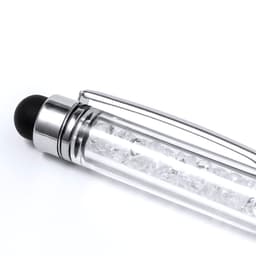A clear ballpoint pen with a silver clip and a black stylus tip, featuring decorative clear crystals inside.
