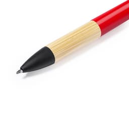 A red and bamboo ballpoint pen with a black tip and branding on the barrel.