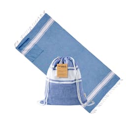 A blue and white Carey drawstring bag beside a blue towel. The bag features a logo and has a drawstring closure.